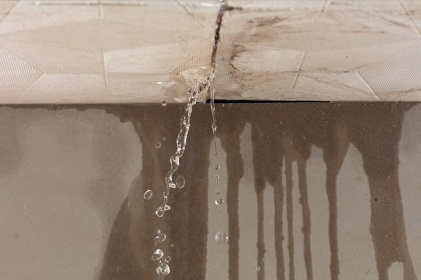 Professional Flood Damage Cleanup technician working in Slinger, WI